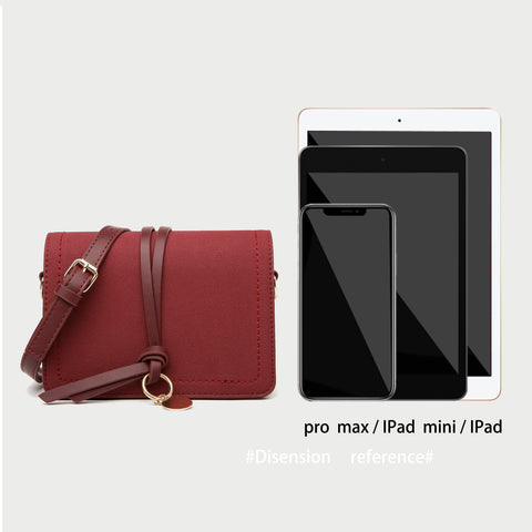 Knotted strap metal disc embellished PU leather crossbody bag