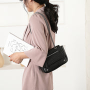Zipped front flap studded PU leather crossbody bag