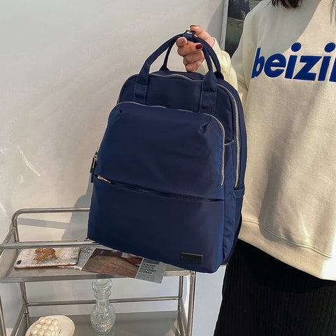 Top handle zip compartment minimalistic unisex nylon backpack