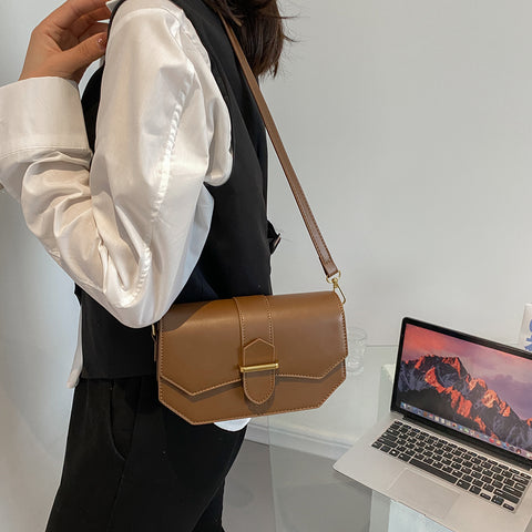 Retro saddle-inspired strap detail flap PU leather crossbody bag