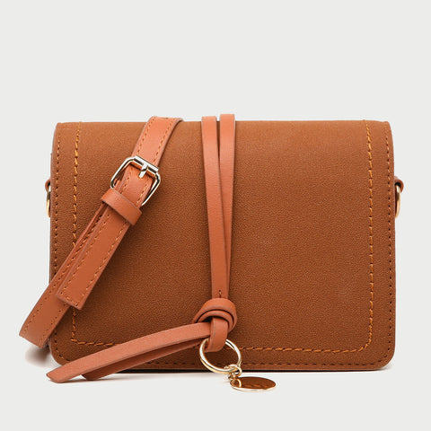 Knotted strap metal disc embellished PU leather crossbody bag