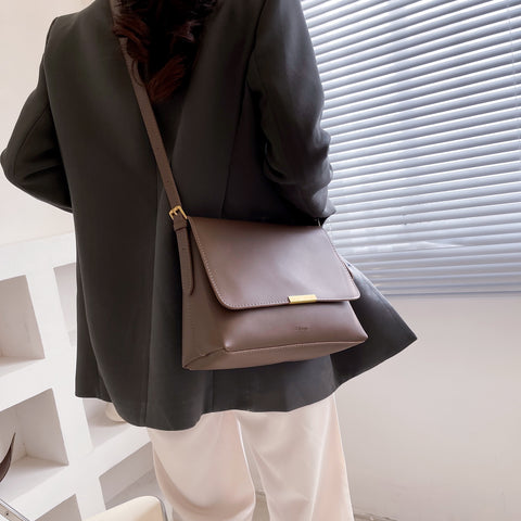 Metal hardware flap style PU leather crossbody bag
