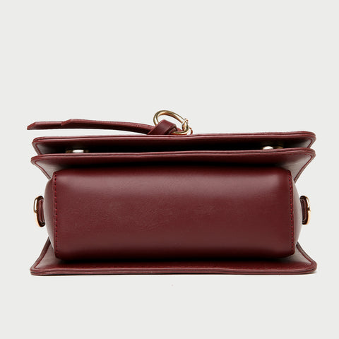 Knotted strap metal disc embellished PU leather crossbody bag